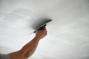 a person renovating their home’s ceilings 