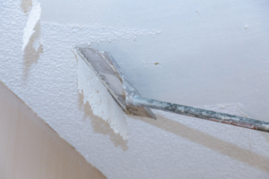 a popcorn ceiling being removed