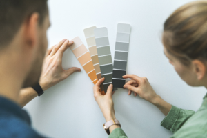 a homeowner speaking with a professional painter