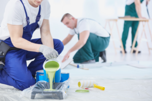 a team of professional painters painting a house