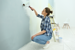 a person painting their home’s walls